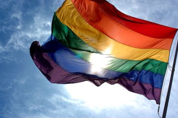 This flag celebrates LGBT pride. Photo courtesy of Ludovic Bertron under CC BY 2.0 license.