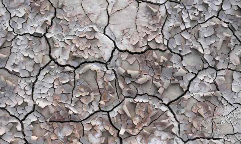 Cracked soil by a village in Iran abandoned by farmers because water reserves ran dry due to overuse. Photograph: Atta Kenare/AFP/Getty Images